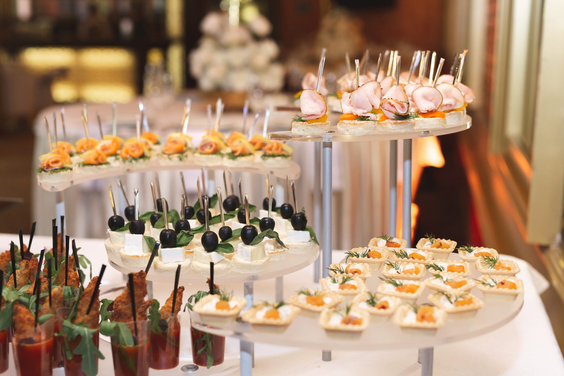 Tiered display of canapés and pairings at a corporate wine reception